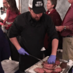 BBQ Caterer cutting prime rib for event